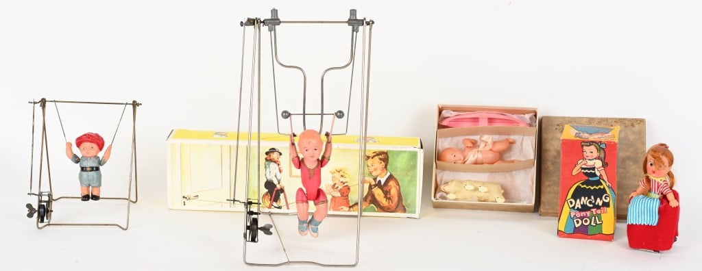 VINTAGE TOY LOT, WINDUPS & MORE: Lot includes Balancing tight rope toy with box, 2- windup Celluloid acrobats, Celluloid Doll set with box and windup Dancing Pony Tail doll with box. Windups work. Largest is 12". Excellent
