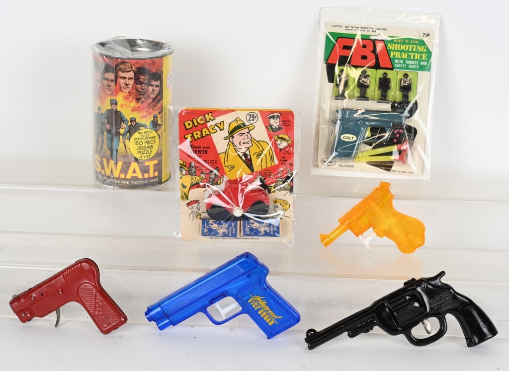 DICK TRACY, FBI, GUNS, & MORE: Includes Dick Tracy Movie Viewer on Card, FBI Shooting Practice Set on Card, Wyandotte Cork Gun, G-Man Clicker Gun, Swat Puzzle, and Lugar Water Gun. Al in great condition.