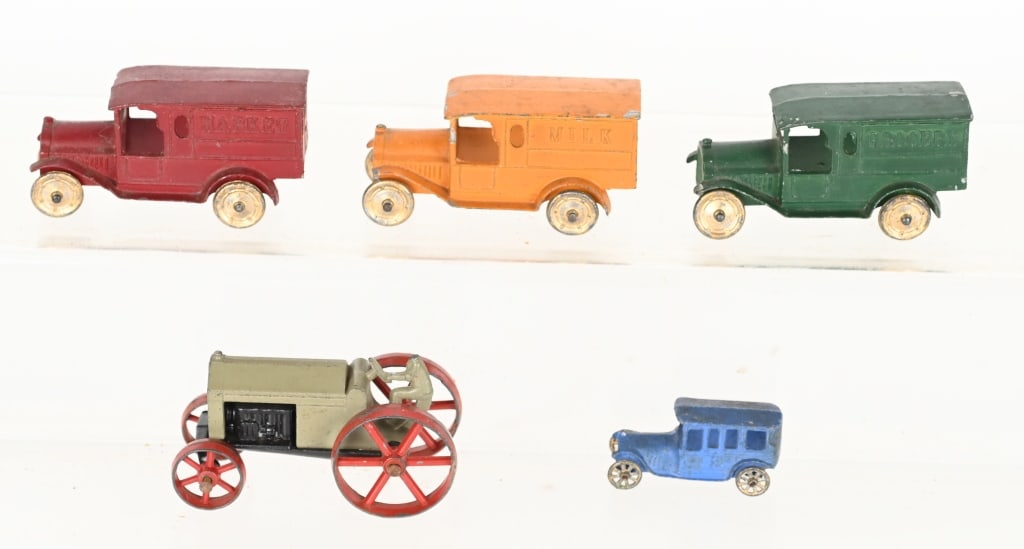 TOOTSIETOY LOT: Includes Milk Truck, 2-Market Trucks, Tractor with broken head. and Small Car. Excellent
