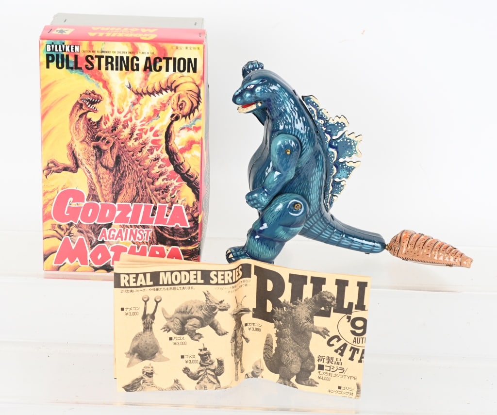 BILLIKEN GODZILLA AGAINST MOTHRA MIB: Billiken Godzilla against Mothra. Tin Godzilla with pull string Motra. Never played with. With Papers and Box. 8" Excellent