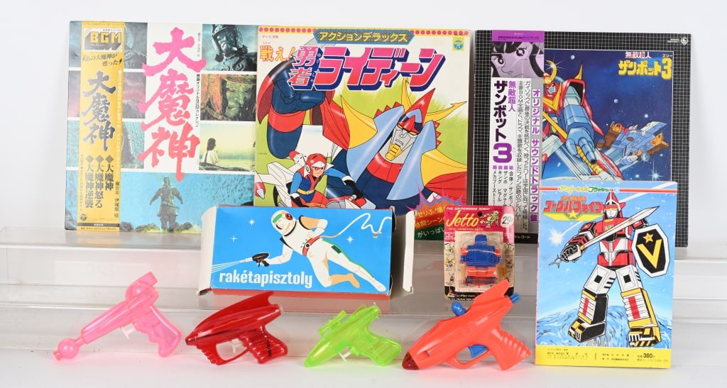 SHOGUN, ROBOT, & SPACE GUN LOT: Includes 3 Japanese Shogun 33 1/3 records, Voltron Book, Jetto Robot on Card, Tin Friction Space Gun with Box, Space Gun with Astronaut, and Space Squirt Guns. Excellent