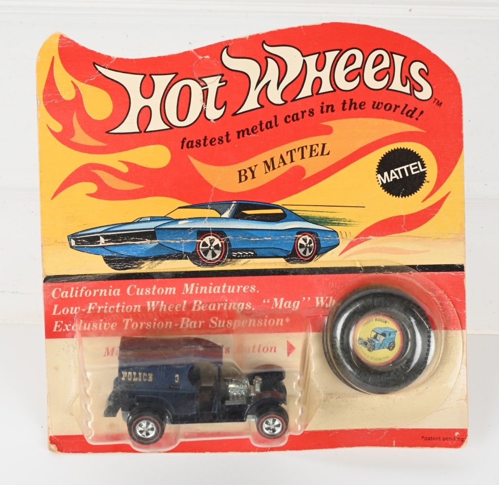 1969 HOT WHEELS REDLINE PADDY WAGON MOC: 1969 Hot Wheels Redline Paddy Wagon. Blue in color. Minty sealed on blister pack with button. Creased card