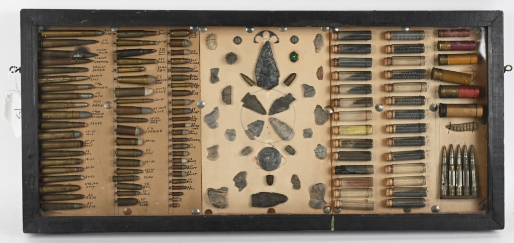 FANTASTIC HAND MADE BULLET BOARD 1885 TRADE DOLLAR: Fantastic Handmade Bullet Board measures 29 1/2 X 13 1/2 inches and is period framed with cartridges from the Civil War through the 1920's with several rare cartridges and components of cartridges suc
