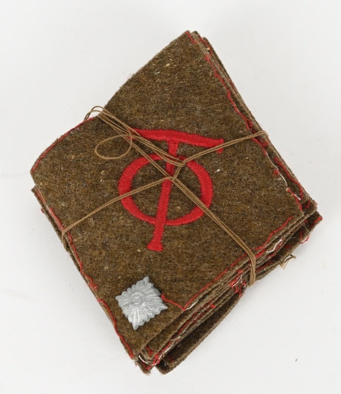 WWII NAZI GERMAN ORG. TODT COLLAR TAB LOT OF 10: Diamond-shaped collar tabs, 70mm wide x 90mm tall. The "OT" monogram machine embroidered in red on a olive drab wool backing lot of 10, still strung up from the manufacturer. MINT! "Organization Todt"