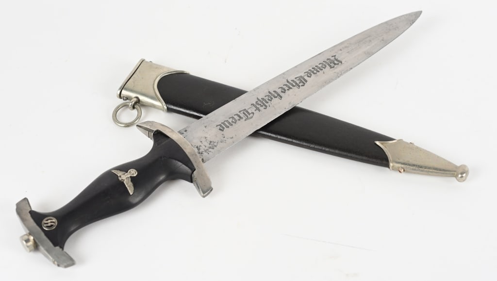 WWII NAZI GERMAN SS M33 SERVICE DAGGER HAMMESFAHR: Dagger features a roughly, 22cm long, double edged, drop forged steel construction, nickel/silver plated blade with a low central ridge. The nickel/silver plated blade is in nice condition and looks t