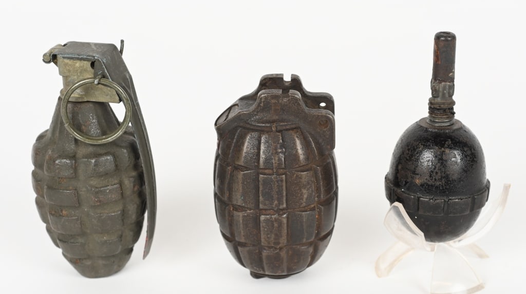 WWI & WWII US BRITISH GERMAN HAND GREANDE LOT: Lot of three hand grenades to include 1) WWI BRITISH MILLS BOMB NO. 5 HAND GRENADE, British No. 5 MkI "Mills Bomb" Grenade. This is the first version of the "Mills Bomb" produced, and w