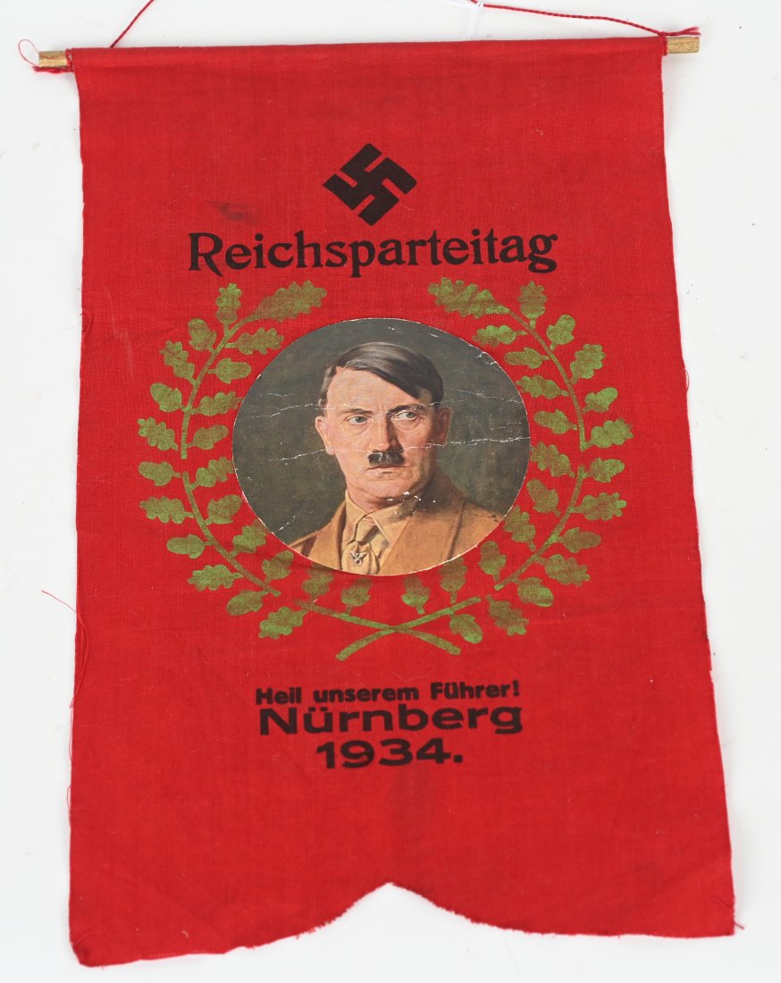 WWII NAZI GERMAN 1934 REICHSPARTEITAG BANNER FLAG: Rare 1934 Reichsparteitag double sided Banner measuring 14 X 8 1/2 inches for the 6th annual Nazi Party Rally in Nuremberg, Germany. To the obverse an applied image of Adolf Hitler it its center with 