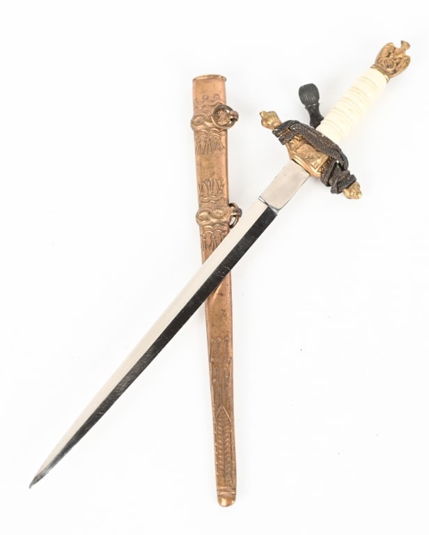 WWII NAZI MINIATURE KRIEGSMARINE DAGGER W KNOT WW2: WWII German Kriegsmarine Naval Dagger complete with a "lightning bolt" style brass scabbard. It measures 8 inches long, with a 5 1/2 inch long nickel plated blade. This was probably purchased or given