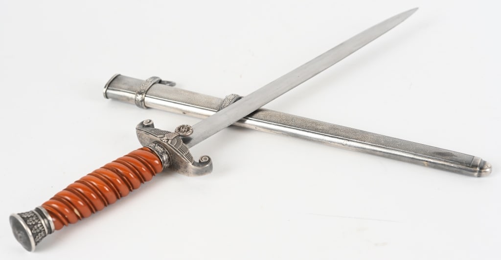 WWII NAZI GERMAN OFFICER WEHRMACHT DAGGER WW2: The dagger features a roughly, 26cm long, drop forged steel construction, nickel/silver plated, stiletto style blade with a flat central ridge. The blade is in overall excellent condition with minor s