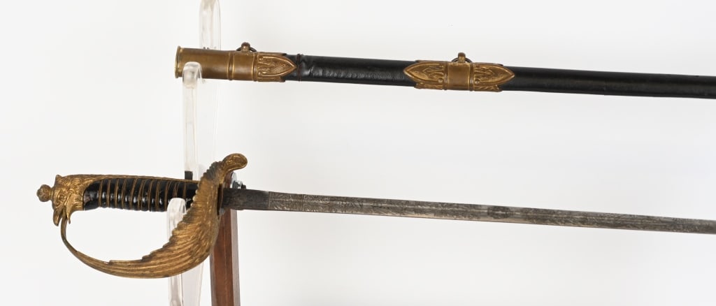 WWII FASCIST ITALIAN AIR FORCE OFFICER SWORD WW2: World War Two Italian officer's dress sword with eagle head pommel and feathered wing guard design with propeller shaped scabbard release button on the guard. Double etched 30" blade, 35" overall leng