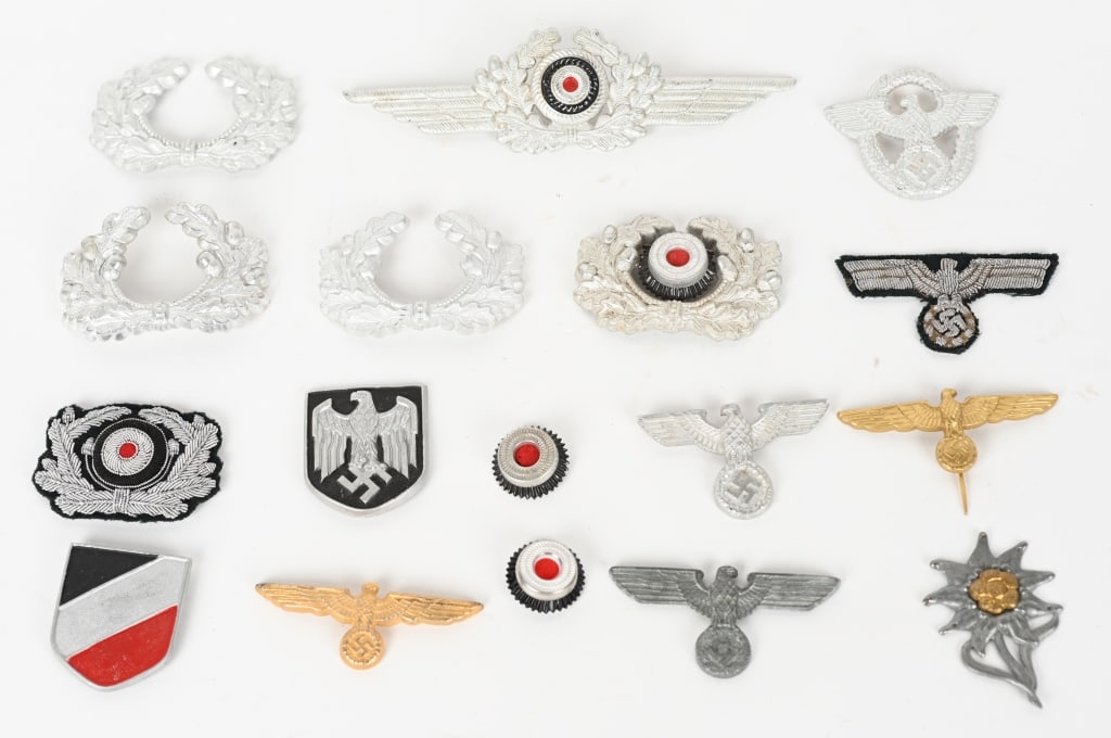 WWII NAZI GERMAN CAP OR HAT INSIGNIA HEER NSDAP: Lot of WWII Nazi German insignia to include Visor Hat and Pith Helmet Insignia. All but one having the original prongs. Insignia includes a Wehrmacht Officers Bullion Cap badges, Pith Helmet Shie