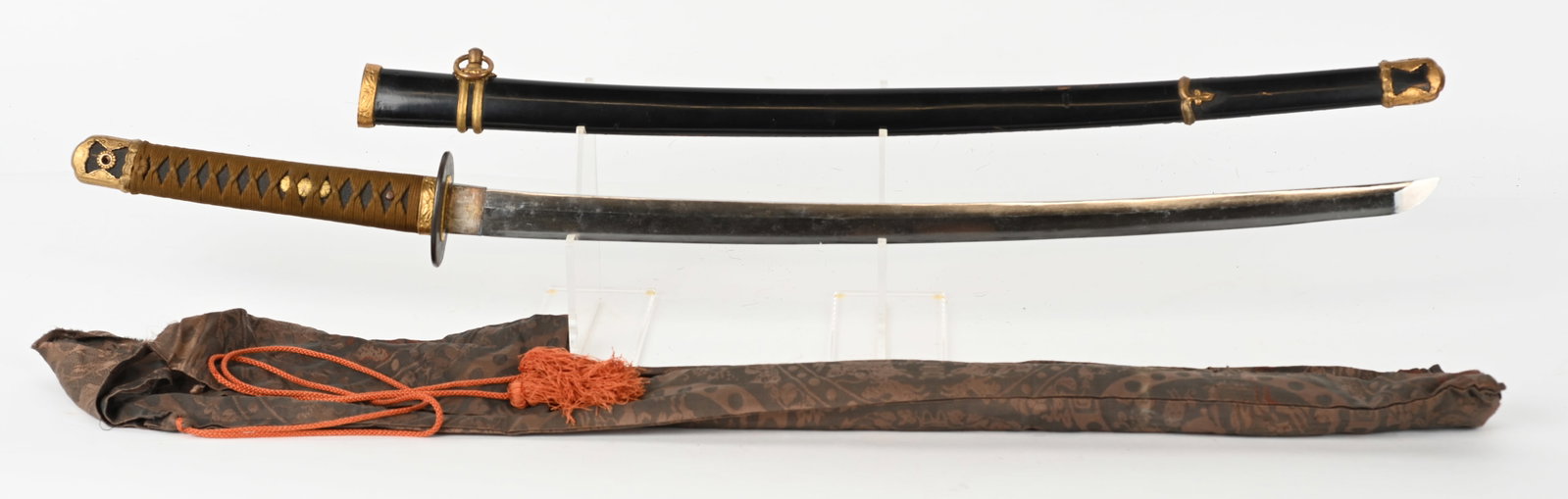 WWII IMPERIAL JAPANESE NAVAL OFFICER'S KATANA WW2: 25" cutting edge with naval anchor stamp on one hole tang. Blade is bright with straight hamon. WWII mounts on Tsuka, Ray skin with silk wrap, and silk sword knot attached. Plain iron tsuba. Has nice 