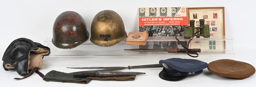 MILITARY LOT GERMAN US M1 HELMETS INSIGNIA BADGES: Lot of militaria to include US medals, patches and insignia, Post WWII US Navy Jumper, Soviet Tanker Helmet, Gold painted M1 Helmet with Liner with a bale missing, WWII US Officers hat missing visor, 