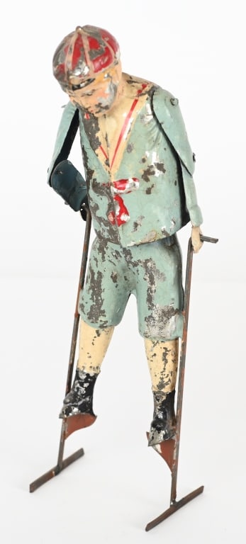 GERMAN HAND PAINTED TIN WINDUP BOY ON STILTS (1 of 4)
