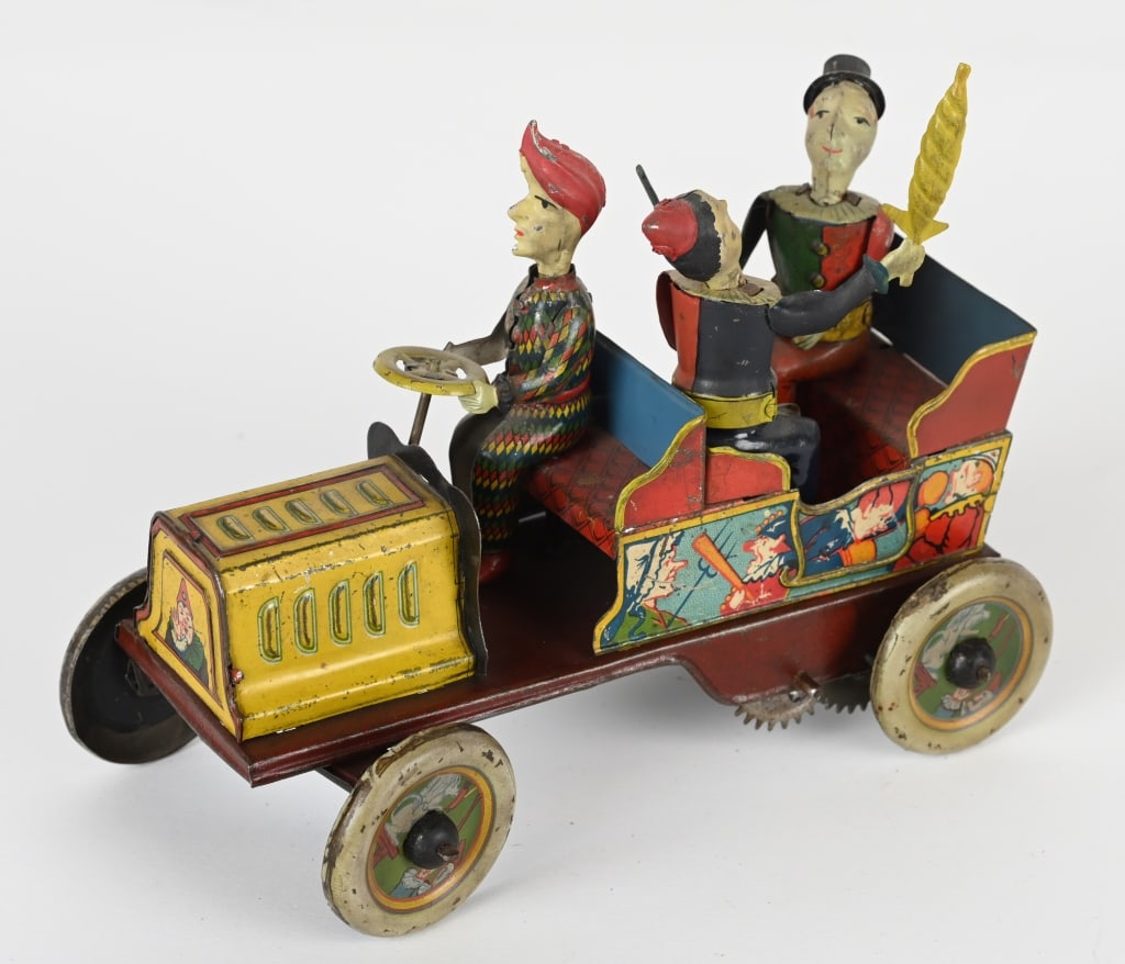 HANS EBERL TIN WINDUP TA-RA-RA-BUMM CLOWN CAR: German tin windup Ta-Ra-Ra-Bumm Clown Car. All original and complete. Toy has nice colors and graphics. Windup works but sticks. Nice example of this desirable toy. 7" Excellent