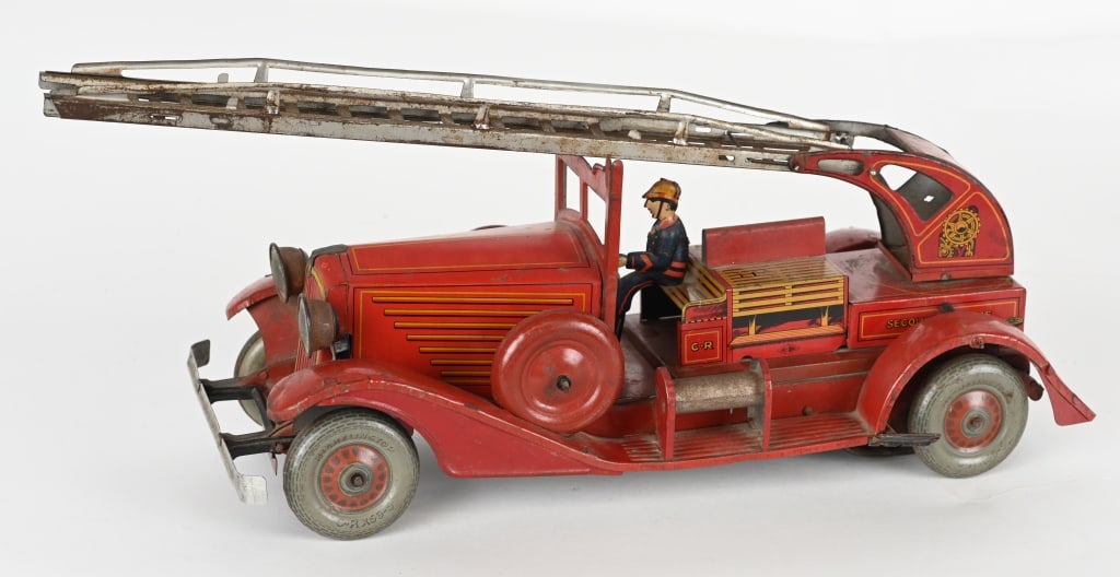 FRENCH CLOCKWORK LADDER FIRE TRUCK: French tin windup Ladder Fire Truck. All original with nice details. Windup works. Missing Firemen on back. Large impressive toy. 15" Excellent
