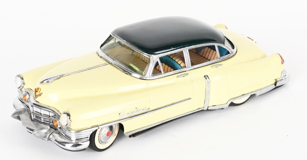 MARUSAN BATTERY OP 1954 CADILLAC SEDAN: Japan battery operated Cadillac Sedan. Professionally restored. Did not work when tested. 12 1/2" Excellent