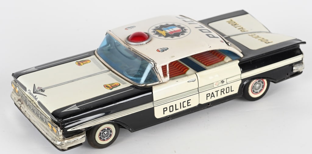 JAPAN TIN FRICTION CHEVY IMPALA POLICE CAR: Japan tin friction Chevy Impala Police Car. All original in great shape. Friction works. 12" Excellent