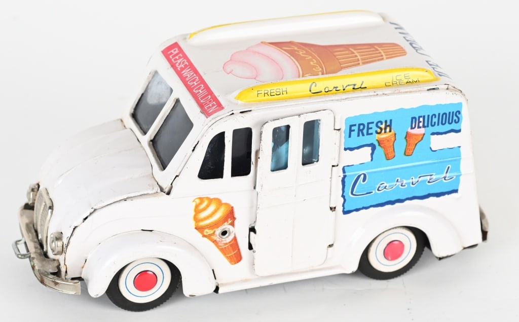 JAPAN TIN FRICTION DIVCO ICE CREAM TRUCK: Japan tin friction Divco Ice Cream Truck. Nice looking truck with great graphics. Has opening door with replaced Ice Cream Vendor. Friction works. 7 1/2" Excellent