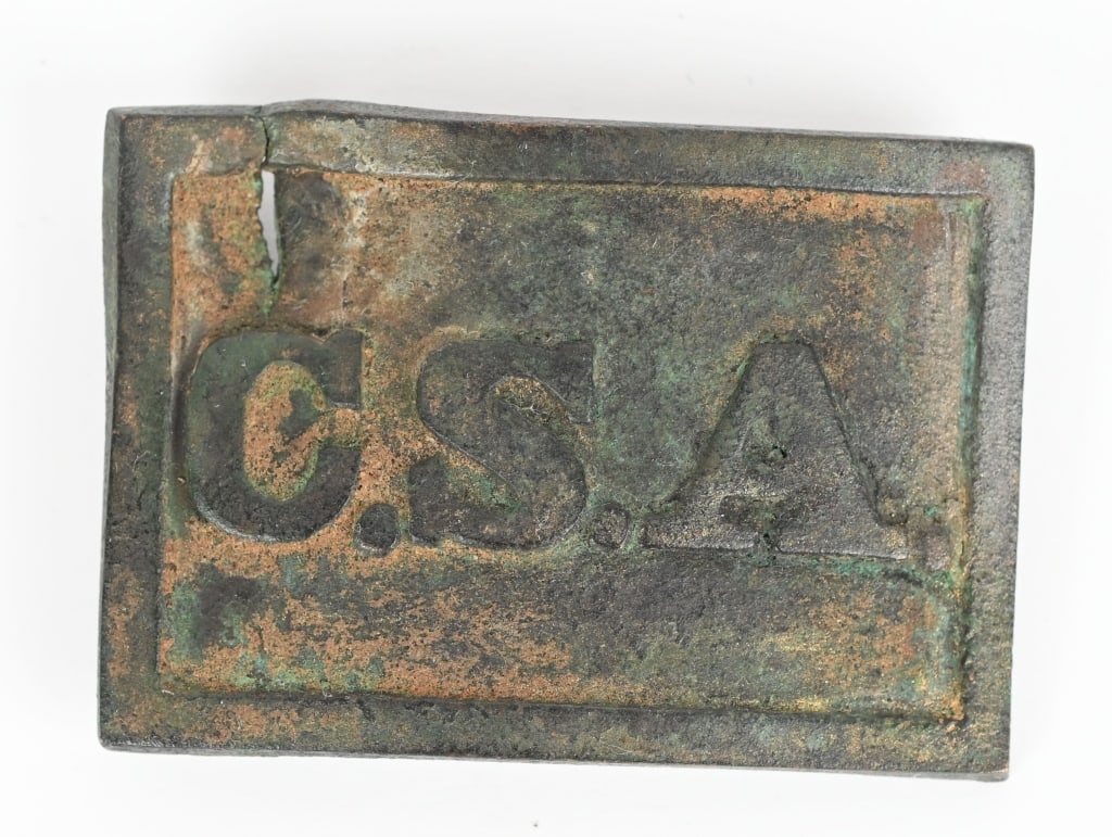 CIVIL WAR CONFEDERATE VIRGINIA STYLE BELT BUCKLE: Confederate Bullet Struck CSA Belt Buckle. Brass belt buckle with raised lettering reading "C.S.A." Excellent condition with a lovely patina having all two prongs to the reverse with one missing due t