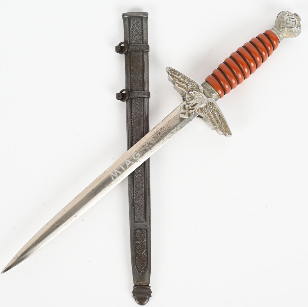 WWII NAZI LUFTWAFFE MINIATURE DAGGER WW2: This example of a beautiful 2nd model Luftwaffe dagger with portepee measures 10 inches overall. The pommel and crossguard are extremely well done being identical to the large counterpart. The grip is