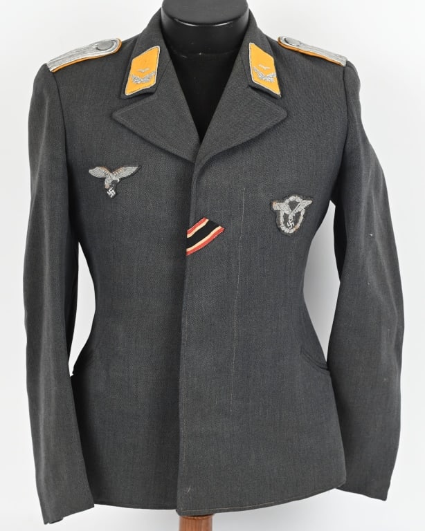 WWII NAZI GERMAN LUFTWAFFE PILOT FLIGHT BLOUSE WW2: Nice quality, private purchase, Luftwaffe blue/gray, wool/rayon blend construction flight blouse features a vertical, four button, French fly, front closure with the buttons on the right front panel a