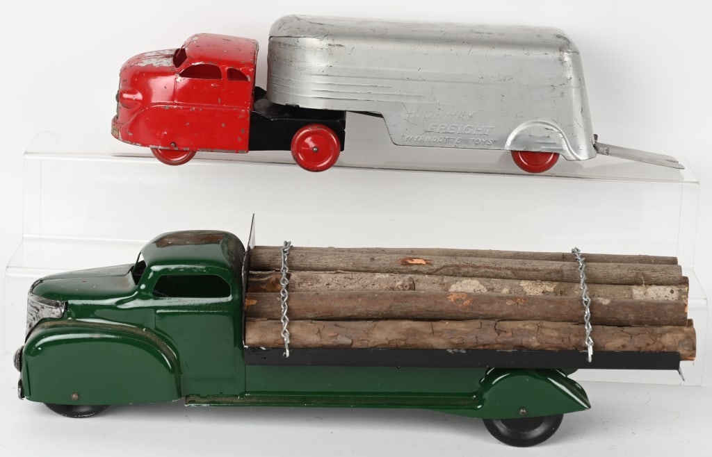 MARX & WYANDOTTE PRESSED STEEL TRUCKS: Lot includes 20" repainted Marx log truck along with a Wyandotte Highway Express truck. The Wyandotte has original paint but has wear and loss. AS-IS