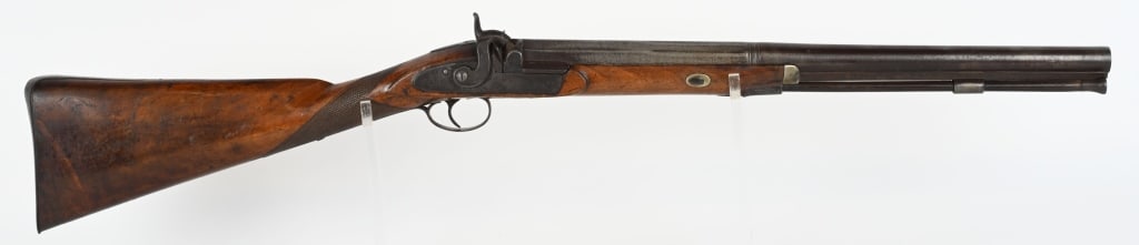 SHORT BARREL PERCUSSION FOWLER: BARREL 20.5". GAUGE .75. Engraved frame, checkered walnut half stock, period rod, single trigger. Condition. Metal is smooth patina. Wood is very good with crisp checkering. Working order. Bore is dar