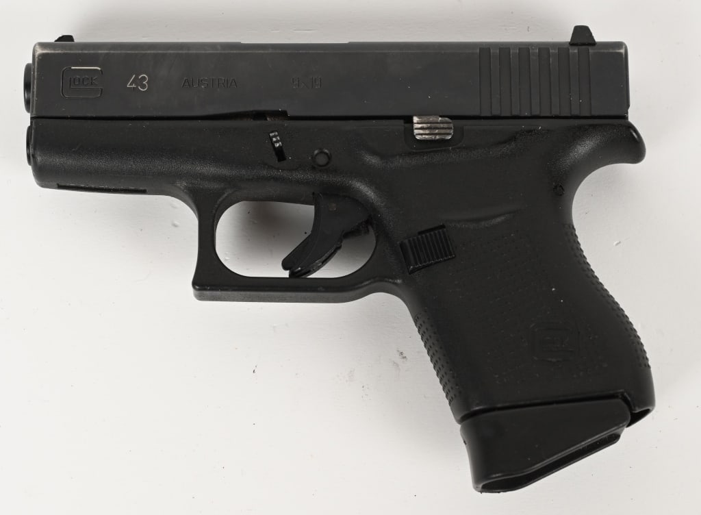 GLOCK 43 GEN 4 SEMI AUTOMATIC PISTOL: SERIAL NUMBER: BAXG523 BARREL: 3 1/4" CALIBER: 9MM. Black polymer frame with GLOCK logo molded in left side and standard texture. ONE 6 round magazine, Black Factory finish on slide with standard sigh