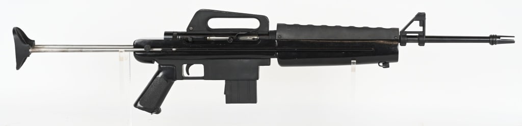 ARMSCOR M16 .22LR SEMI AUTO RIFLE: SERIAL NUMBER: A196134. BARREL: 18". CALIBER: .22LR. MANUFACTURED: 1990's / 2000's. Made in the Philippines. Pronged flash hider, with post front sight and peep rear. Blued/black finishes. Wooden stoc