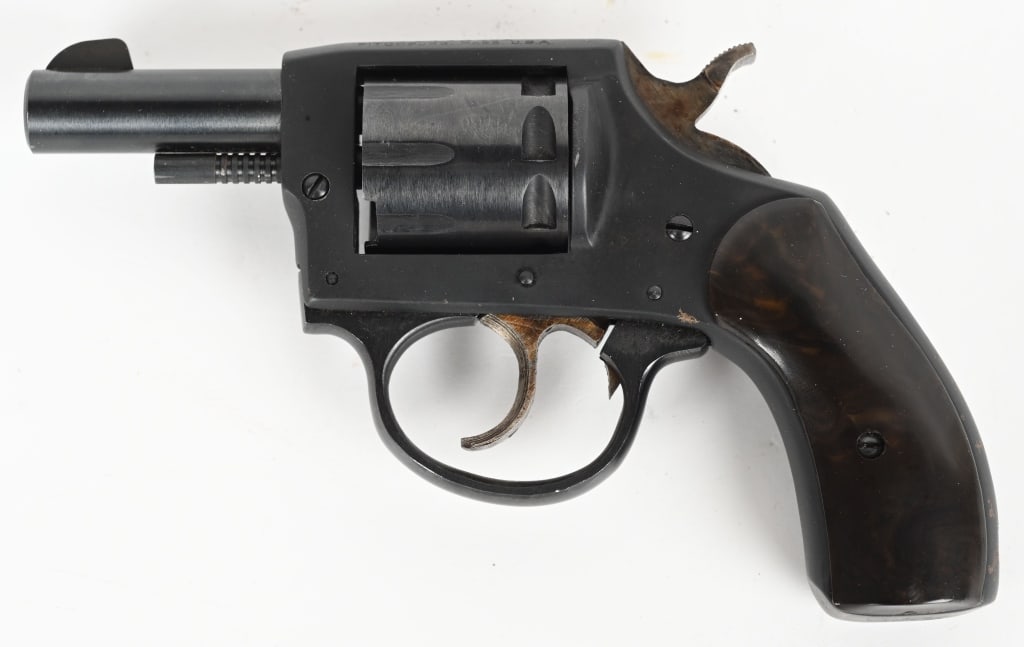 IVER JOHNSON MODEL 55-SA CADET DA REVOLVER: SERIAL NUMBER: H78804. BARREL: 2-1/4". CALIBER: .22LR. MANUFACTURED: 1950S. Blade front sight and u-notch rear. Blued finish and brown plastic grips. Eight shot fluted cylinder. CONDITION: Metal is go