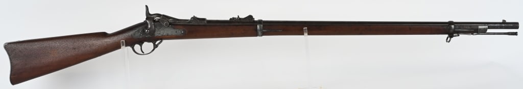 SPRINGFIELD MODEL 1873 TRAPDOOR RIFLE .45-70: SERIAL NUMBER: 134611. BARREL: 32-1/2". CALIBER: .45-70. MANUFACTURED: 1880. "V/P/Eagles Head/P" proofs on the chamber. "U.S./MODEL/1873" marked breech block. Lock plate has typical markings. No visib