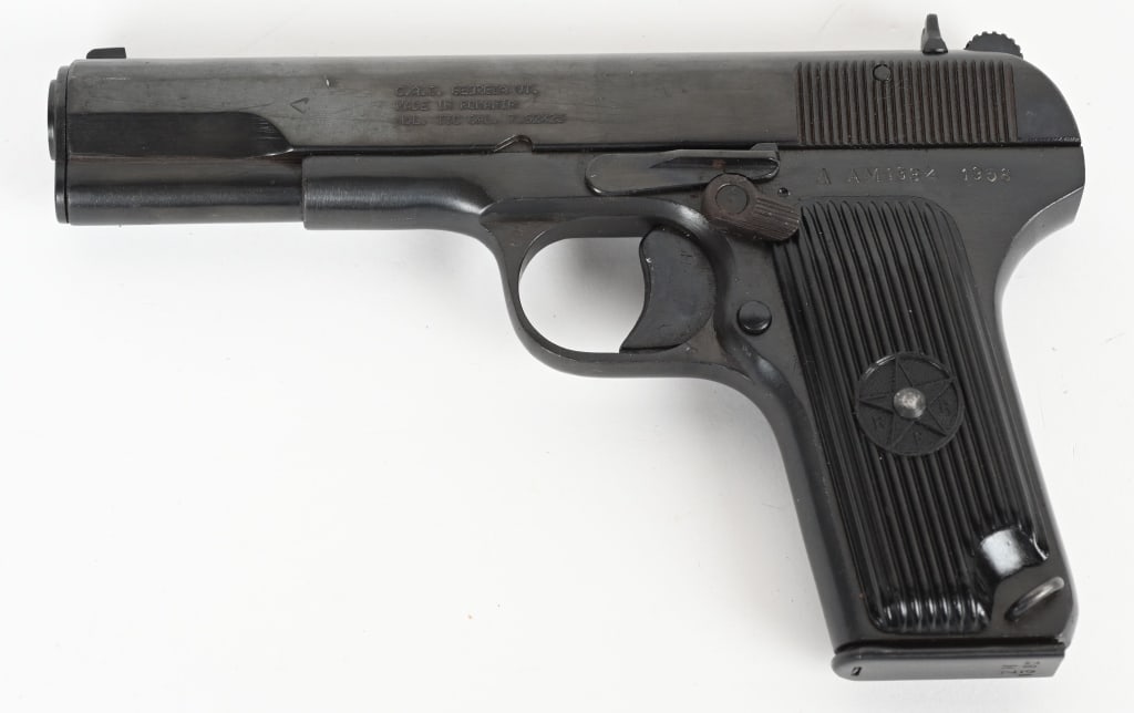 ROMANIAN TTC TOKAREV 7.62X25MM PISTOL: SERIAL NUMBER: AM1834. BARREL: 4-1/2". CALIBER: 7.62X25MM. MANUFACTURED: 1956. Import added safety, with import marked on the left side of the slide. Matching serials. Standard sights. Arsenal blued f