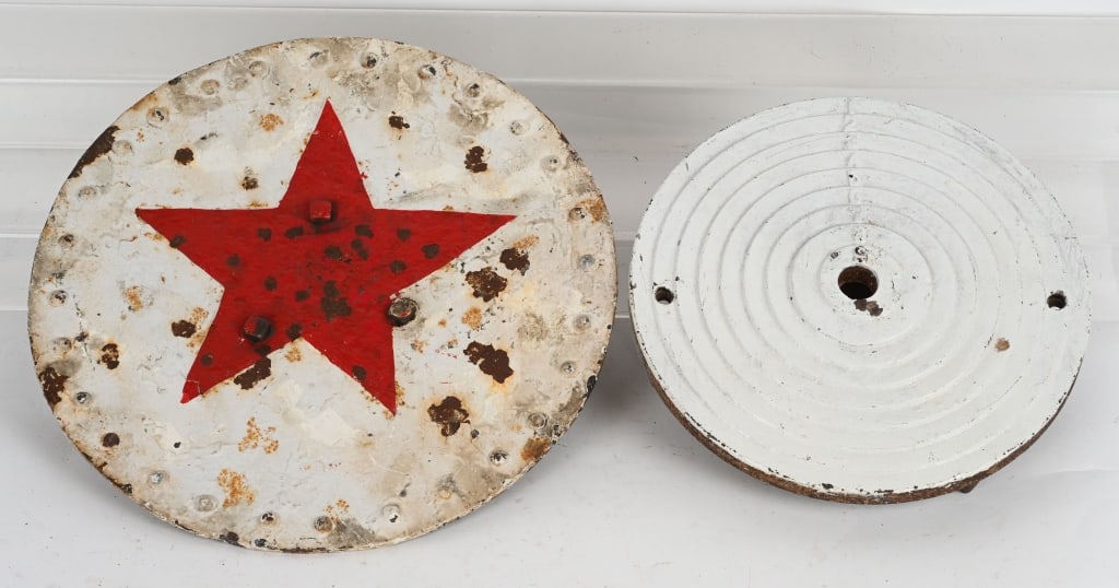 PAIR OF 19TH CENTURY SHOOTING GALLERY METAL TARGET: One measures 12" across and is 1/2" thick steel, rings numbered 1-9. White paint is more recent. Back reads Standard for ..22 CTGS!. Second target features a large red painted star. Measures 15" with