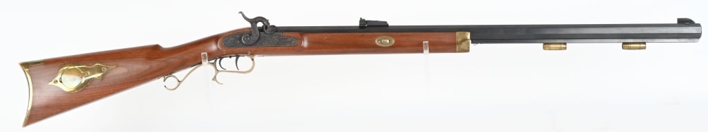 THOMPSON CENTER ARMS HAWKEN PERCUSSION RIFLE: SERIAL NUMBER: 459671. BARREL: 28-3/4". CALIBER: .54 PERCUSSION. MANUFACTURED: 1990S/2000S. octagon barrel, with factory blade front sight and adjustable v-notch rear. Doubel set triggers. Blued barre