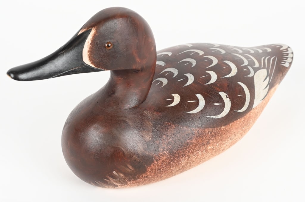 LUTZ CANVASBACK HEN DECOY: Carved wood. Signed on the bottom. Original eyes and hand painted. CONDITION: Excellent overall with light scratches.