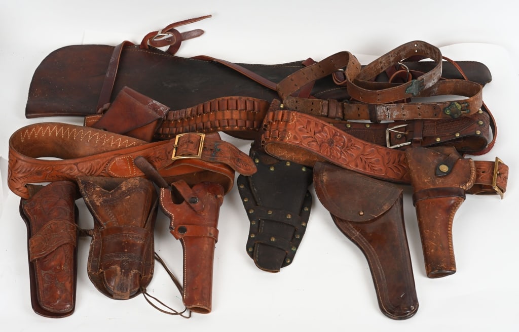 LOT OF LEATER HOLSTERS AND RIFLE SCABBARD: Includes: Brown leather "US" marked Colt 1895 DA revolver holster, with a non military cartridge belt, size small. Viking tooled 6" revolver leather holster/belt, marked "M/38". Geo Lawrence Co. leath