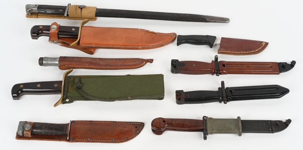 LOT OF 9 VARIOUS BAYONETS AND KNIVES: Includes: Romanian AKM bayonet and matching scabbard. Unmarked Chinese Commercial AKM Type 2 bayonet with black plastic furniture. Unmarked (possibly Russian Type 2 AKM bayonet with brown plastic furn