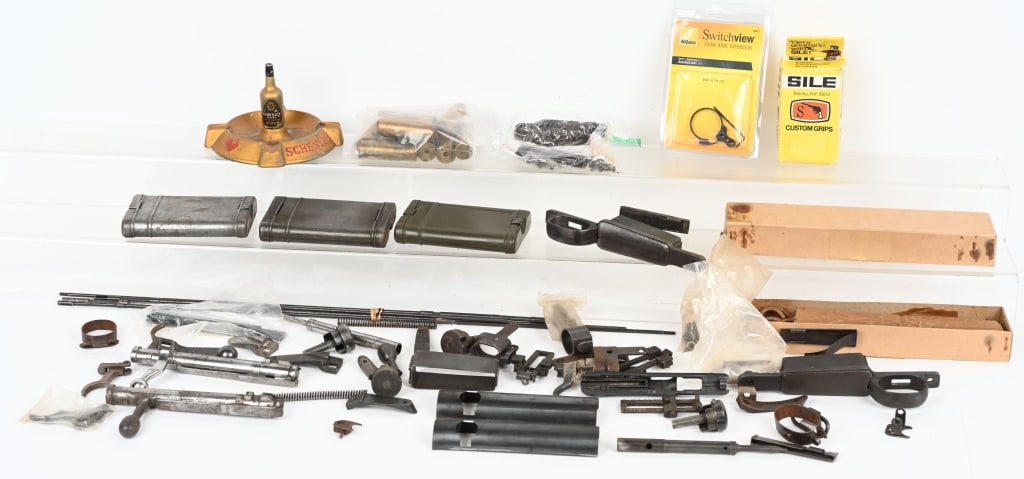 LOT OF VARIOUS RIFLE PARTS AND CLEANING TOOLS: Includes: 3, 10 gauge brass shot shells (empty). 7, 12 gauge brass shot shells (empty. 10 Smith & Wesson Victory model .38 caliber cleaning rods in box. 3 German military rifle cleaning kits in tins (