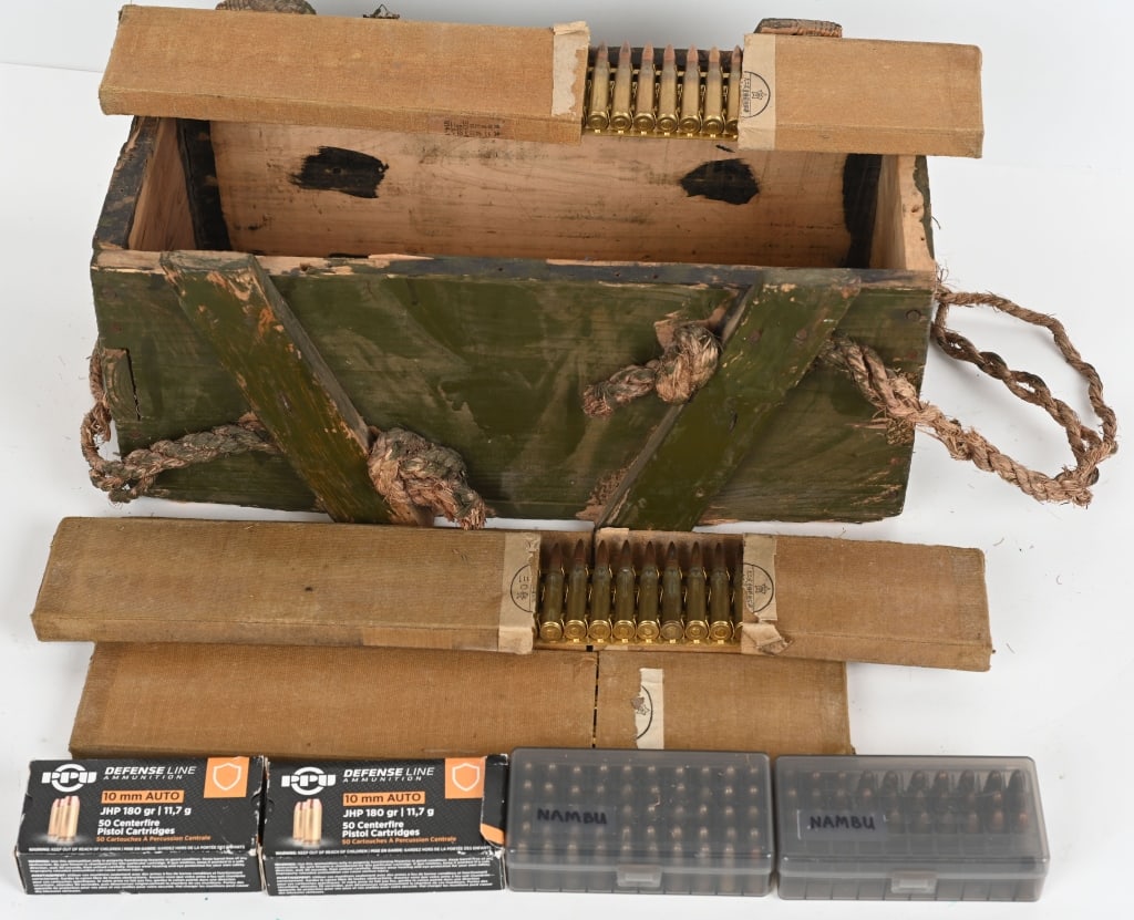 LOT OF 10MM, 8MM NAMBU AND JAPANESE TYPE 92 AMMO: Includes: 100 PPU 10MM AUTO 180gr JHP 80 rounds surplus 8MM Nambu 150 Japanese Type 92 7.7X58 on 30rd brass strips (only for Type 92 MGS), in flat board holders. All comes in a green painted crate fro