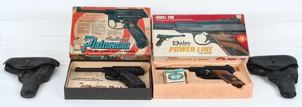 LOT OF 2 AIR PISTOLS AND HI-POWER HOLSTERS: Lot includes: Two post WW2 black leather Browning Hi-Power holsters. One is marked "WILHELM/BOSINGFILED", with the other being unmarked. Daisy Power Line Model 200 Air Pistol with box, instruction she