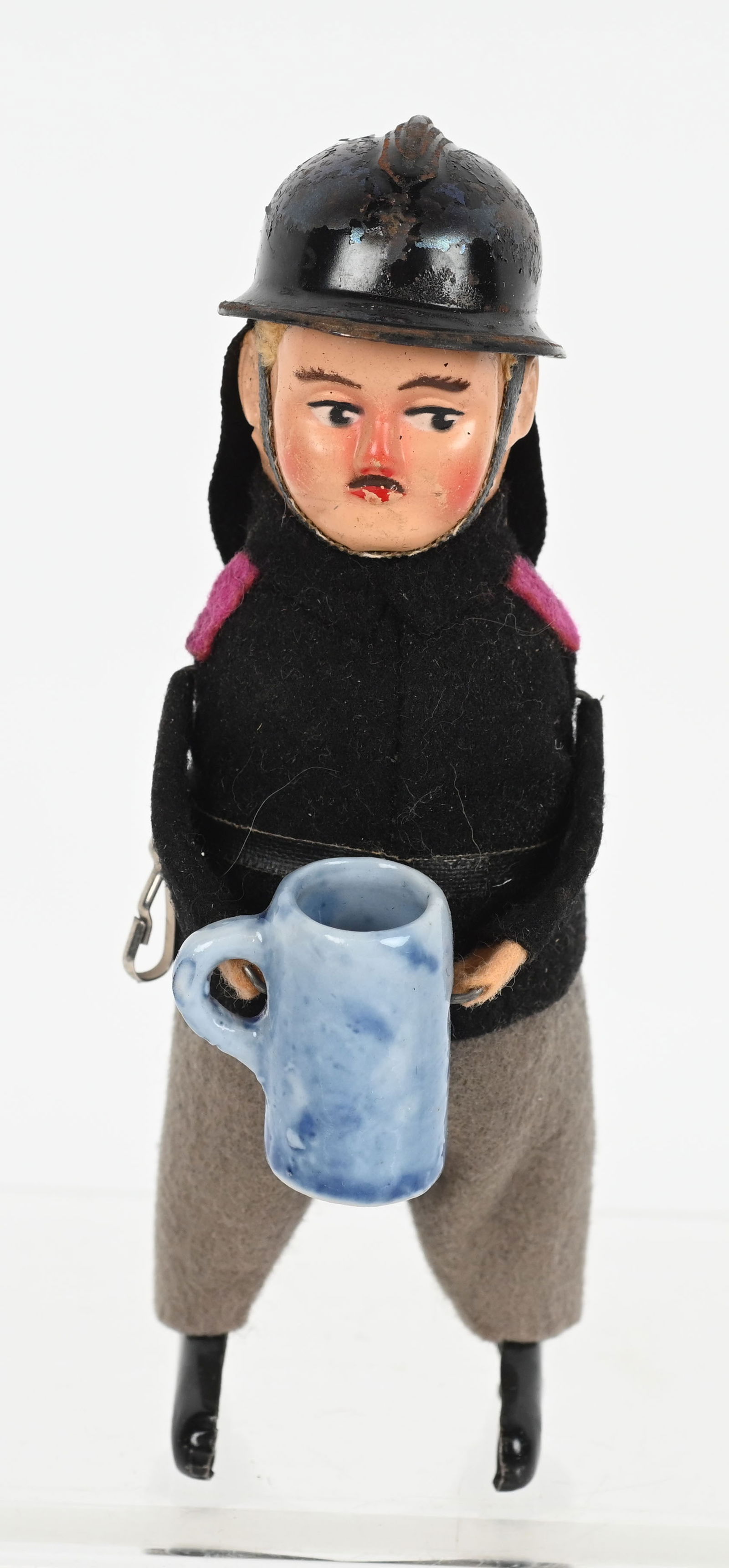 SCHUCO WINDUP FEUERWEHRMANN FIREMAN: Scarce Schuco Fireman with Stein. All original in great shape. Windup works. 5" Excellent