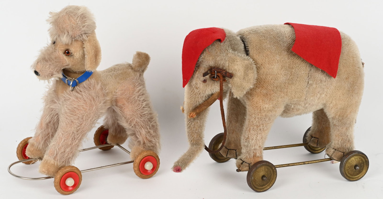 SCHUCO YES/NO ELEPHANT ON WHEELS & POODLE: Includes Yes/No Elephant on wheels. All original in great shape. 1 set of wheels loose. Plus Poodle on Wheels in great shape. Largest 14" Excellent