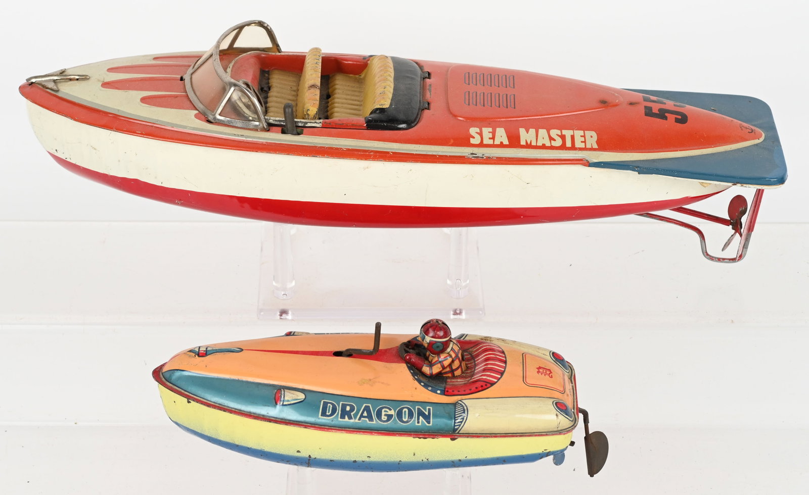2- JAPAN TIN SPEEDBOATS: Includes Windup Dragon and Battery Operated Sea Master. Both all original in great shape. Largest 14" Excellent