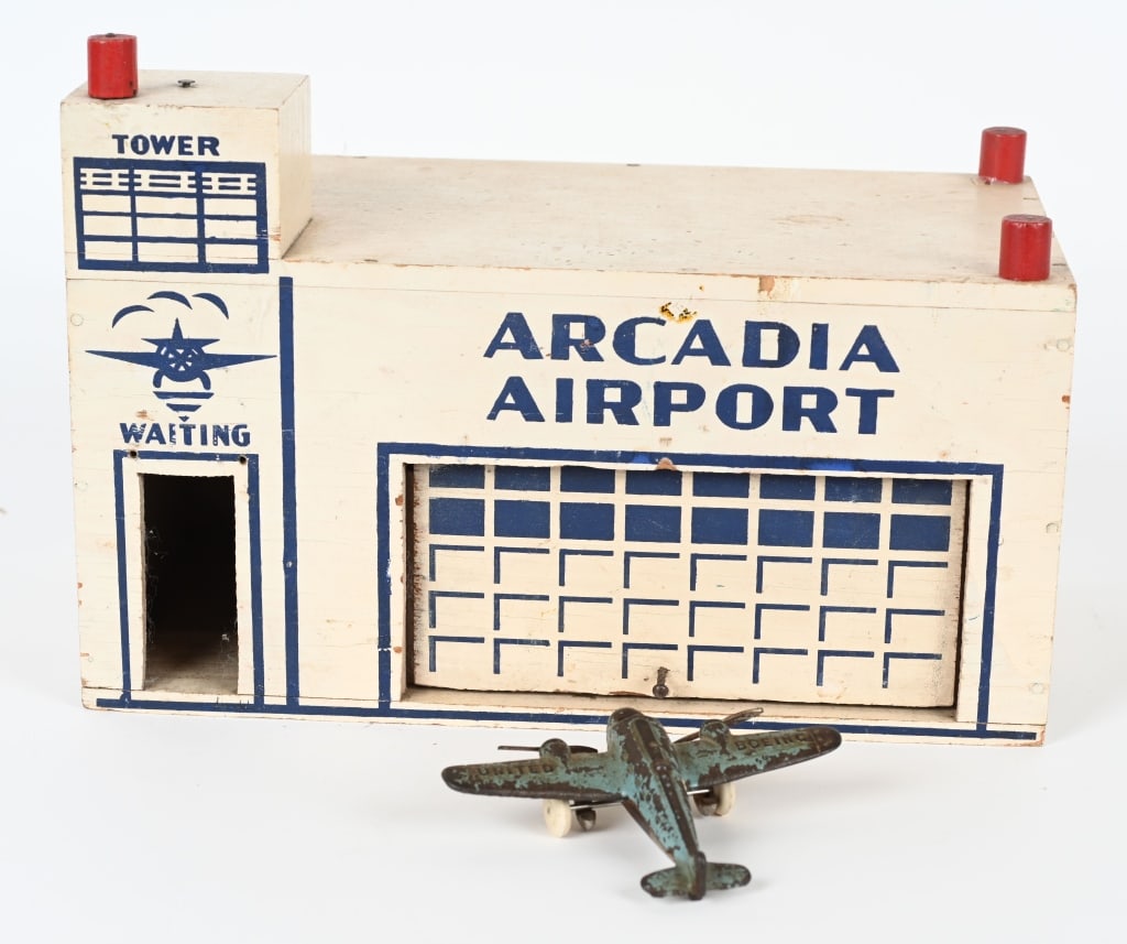 ARCADE ARCADIA AIRPORT & AIRPLANE: Arcade wood Airport, complete and original. Includes Arcade United Boeing cast iron airplane. The airplane has a 4 3/4" wingspan, and has paint wear and replaced tires. The airport is 12" and is Excel