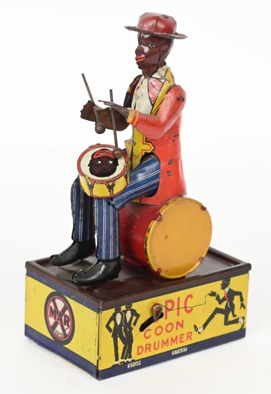 MARX TIN WINDUP SPIC COON DRUMMER: Marx windup Spic Coon Drummer. All original and complete including both arms and the drum. Toy has very nice colors. Windup works. Very nice example of a very hard to find toy. 8 1/2" Excellent