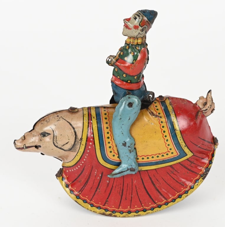 GERMAN TIN WINDUP CLOWN ON PIG (1 of 4)