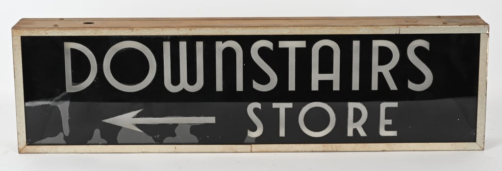 DOWNSTAIRS STORE DOUBLE SIDED GLASS SIGN: Original Downstairs Stores double sided Glass Sign. Electric cord missing. 36"x10" Excellent