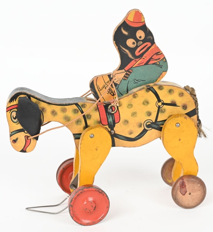 1926 WOODEN SNOWFLAKE ON DONKEY: All original paper on wood. Great colors. dated 1926. 8" Excellent