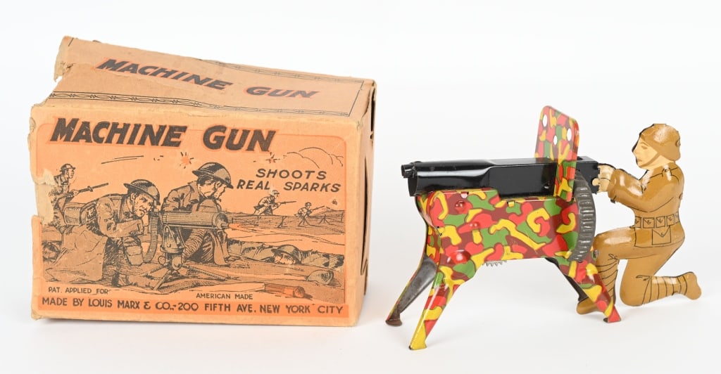 MARX TIN SPARKING MACHINE GUN w/ BOX: Nice earl Marx toy machine gunner. The toy cranks but there are no sparks. Has nice details and colors with gloss. Rare original box is missing an end flap. 5" Excellent